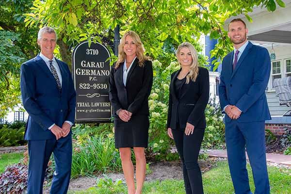 Photo of Attorney Jerry Garau, Attorney Shan Bryant-Haase, Attorney Ashley Hadler and Attorney Reese Sobol
